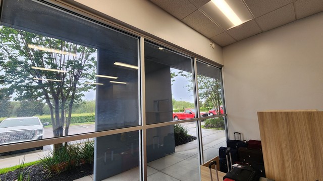 Smooth and Modern Motorized Roller Shades on Emerald Dunes Dr in Orlando, FL